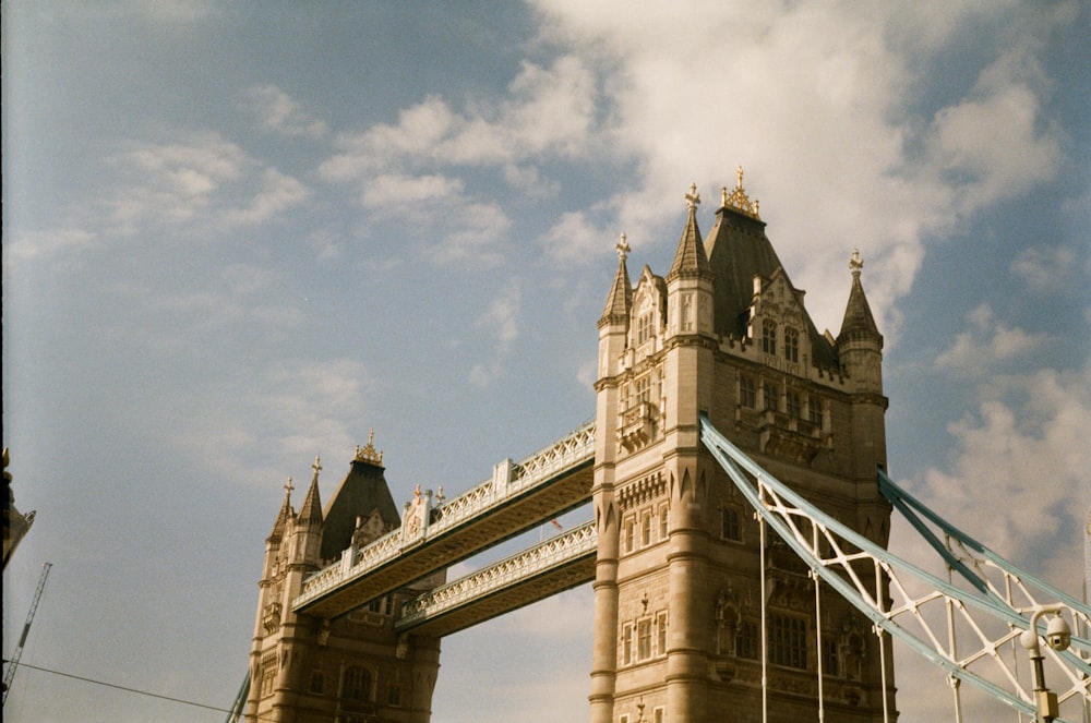 a tall bridge with a sky in the background