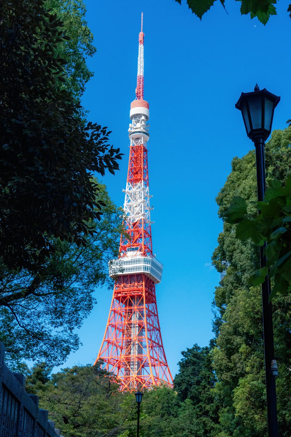 the eiffel tower is lit up in red and white