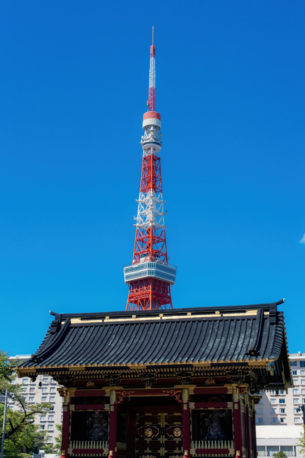 a red and white tower on top of a building