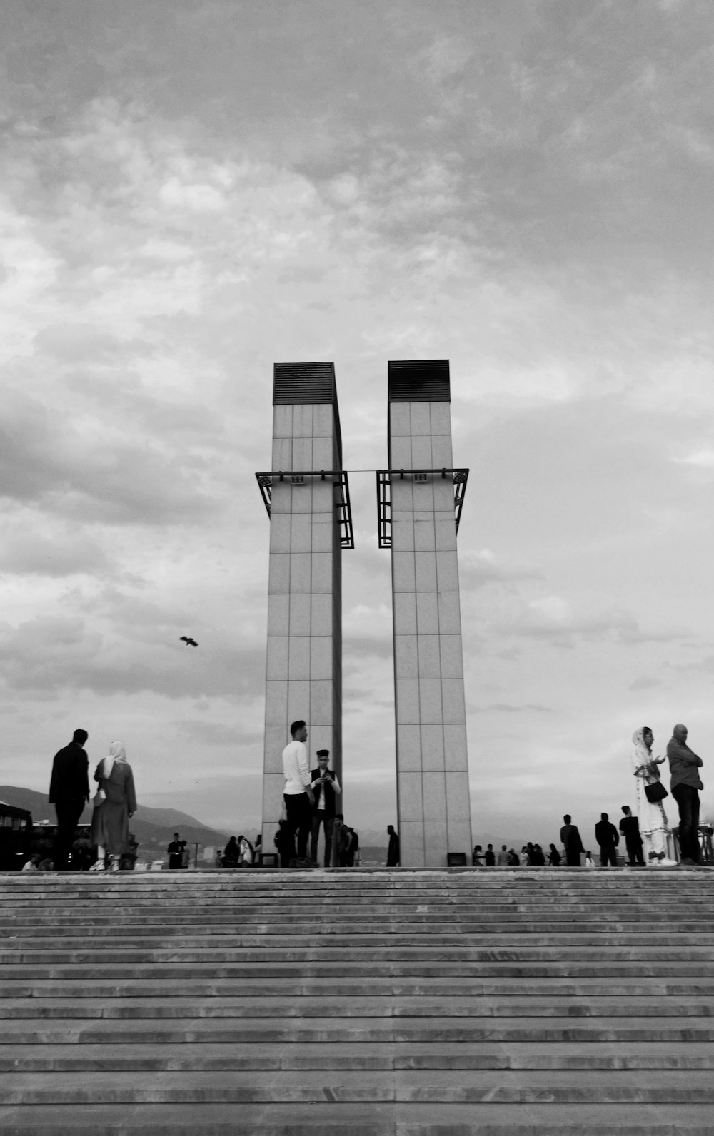 a group of people standing on top of a set of stairs