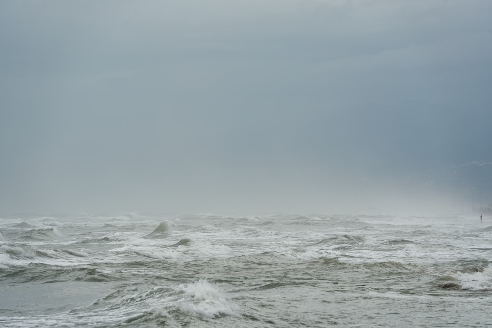 a large body of water with waves coming in