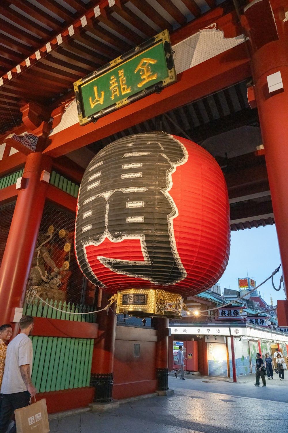 a large lantern with a bear on top of it