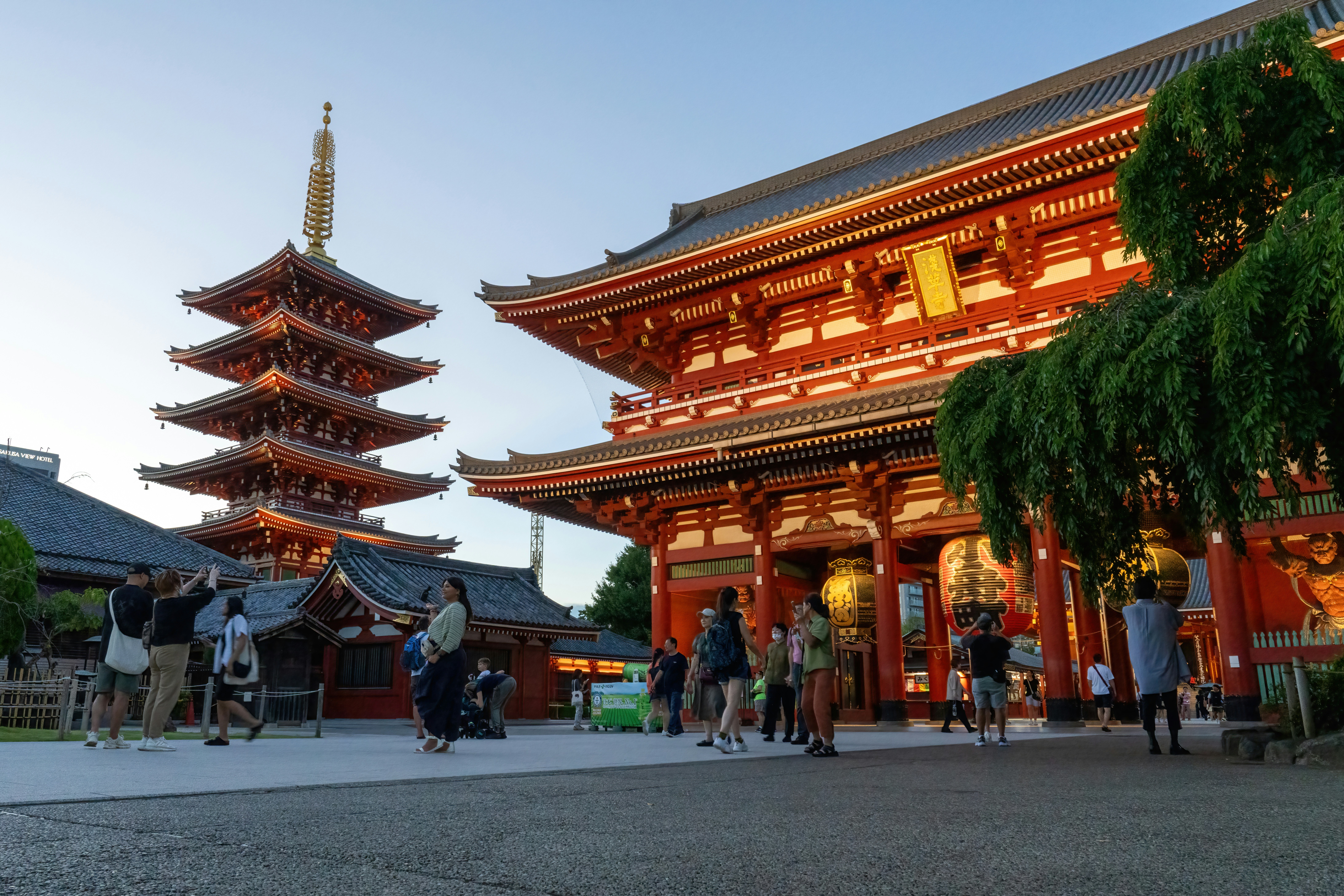 a group of people standing in front of a tall building