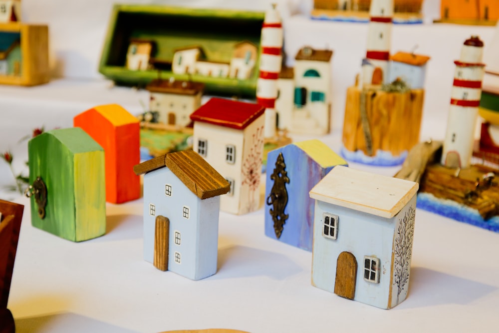 a group of small houses sitting on top of a table