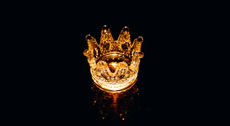 High-tech laser-sintered PFM crown displaying fine metal detailing under bright light.