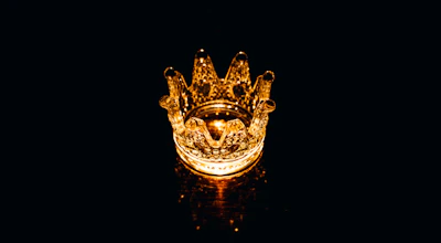 High-tech laser-sintered PFM crown displaying fine metal detailing under bright light.
