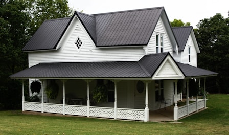 a large white house with a black roof