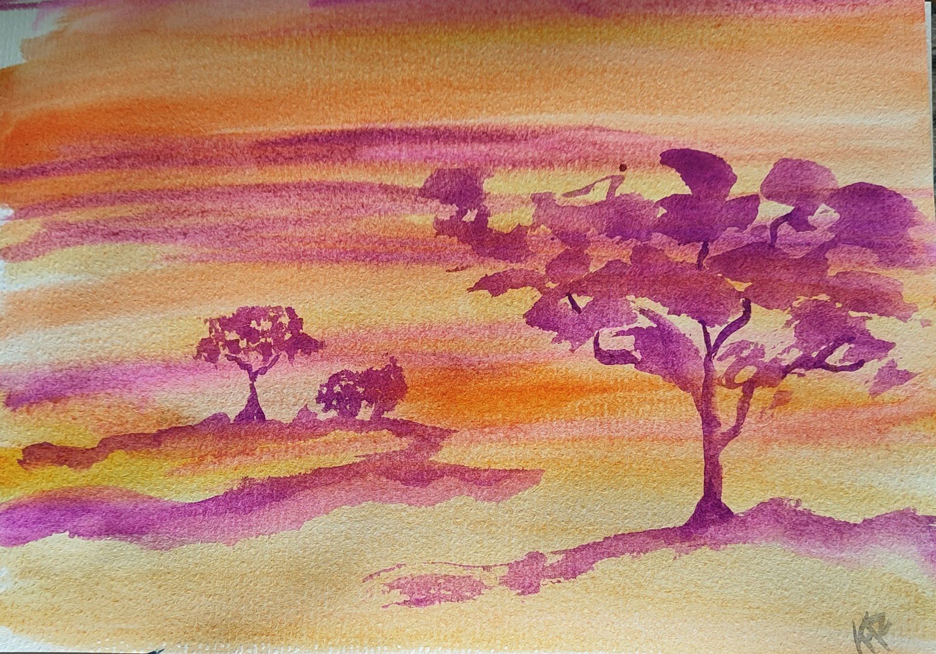 A watercolor painting depicting a serene landscape with two prominent trees in the foreground and middle ground. The sky is painted with warm hues of orange, pink, and yellow, creating a tranquil sunset or sunrise effect.