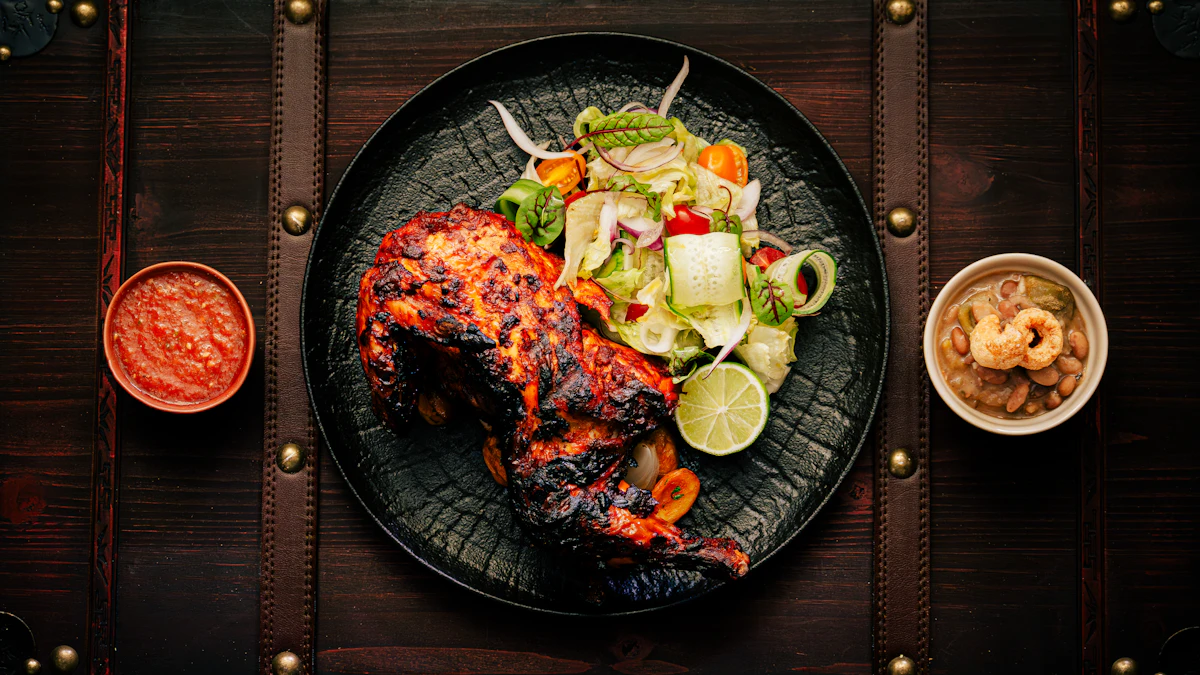 Tandoori chicken on a black plate with a sharp onion salad and chutneys