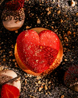A tempting shamrock-shaped dessert, dusted with powdered sugar and drizzled with chocolate.