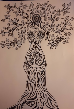 An intricate black and white drawing of a tree with human-like features. The trunk resembles a woman's body, transitioning into branches as arms and a leafy canopy forming the head and hair. Detailed patterns, including flowers and a peace sign, adorn the trunk.