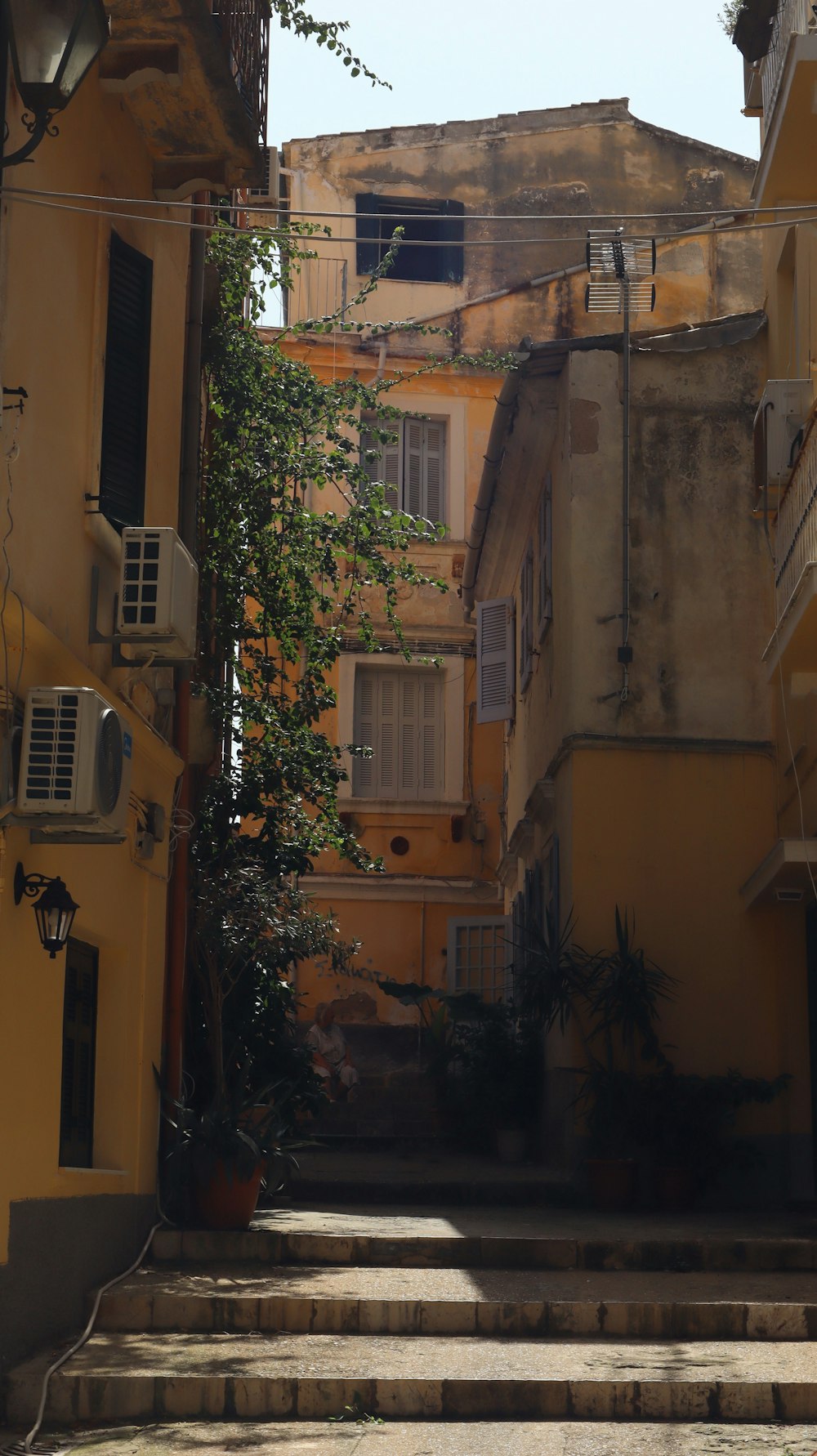 an alley way with steps leading up to a building