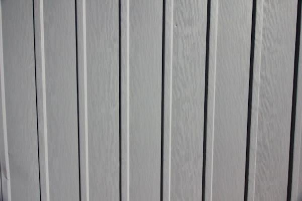 Close-up of a sturdy fiberglass panel with a smooth finish, highlighting its lightweight and durable texture.