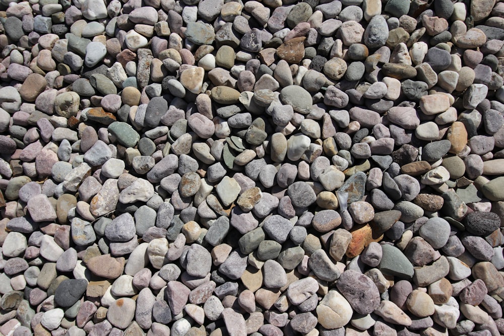 a pile of rocks sitting on top of a sidewalk