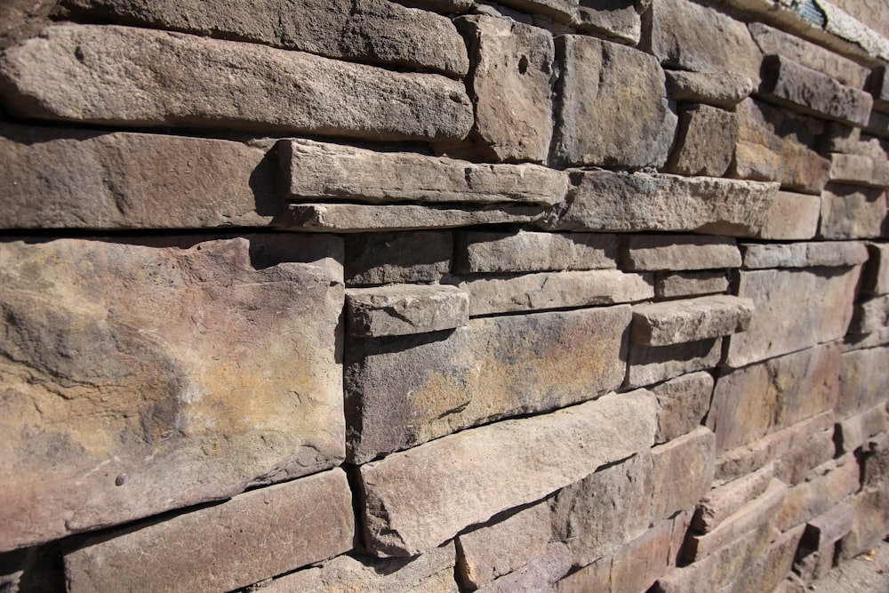a close up of a stone wall made of bricks