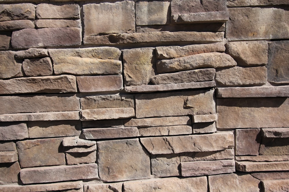 a close up of a stone wall made of bricks
