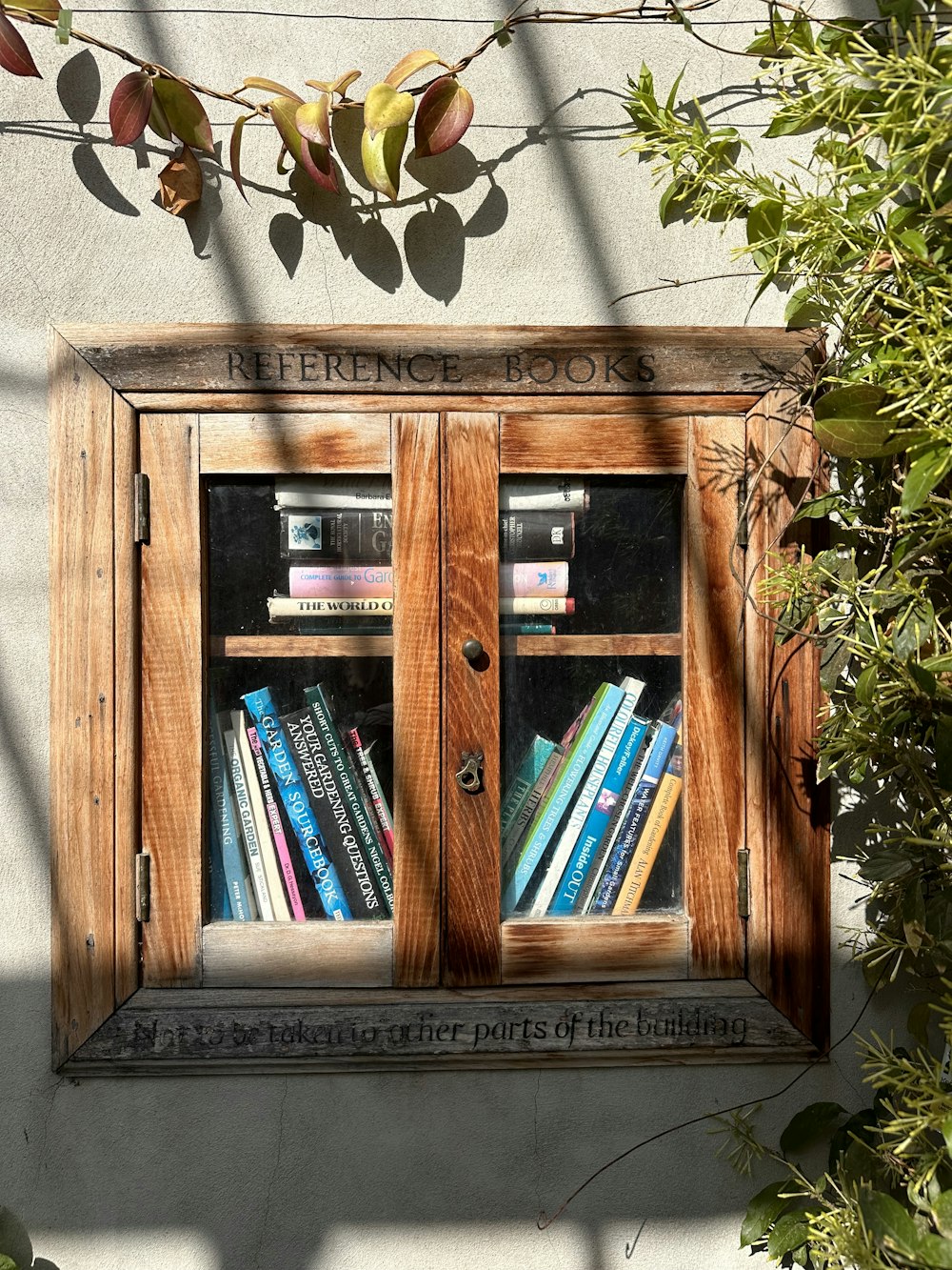a wooden book case with books in it