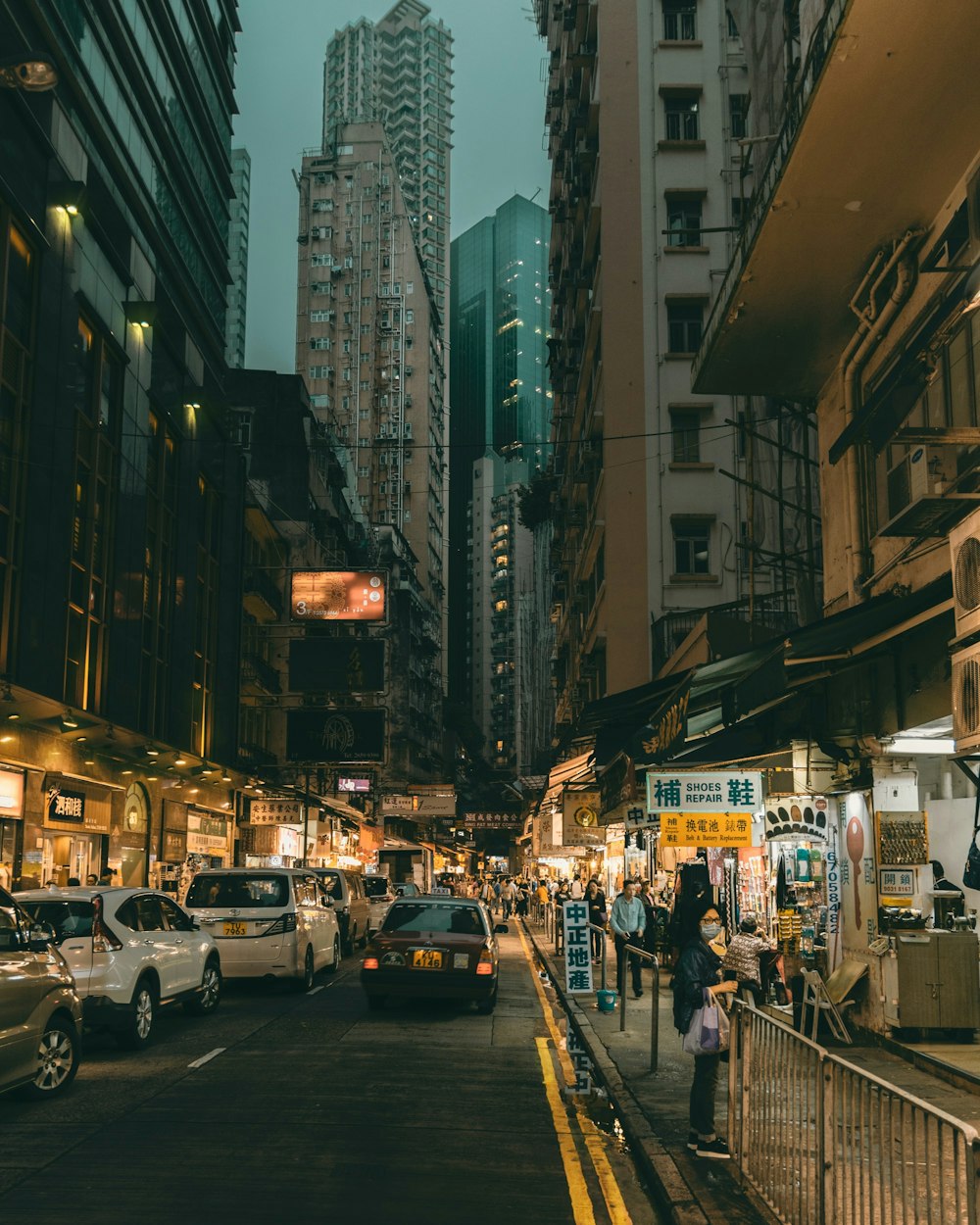 a city street filled with lots of tall buildings