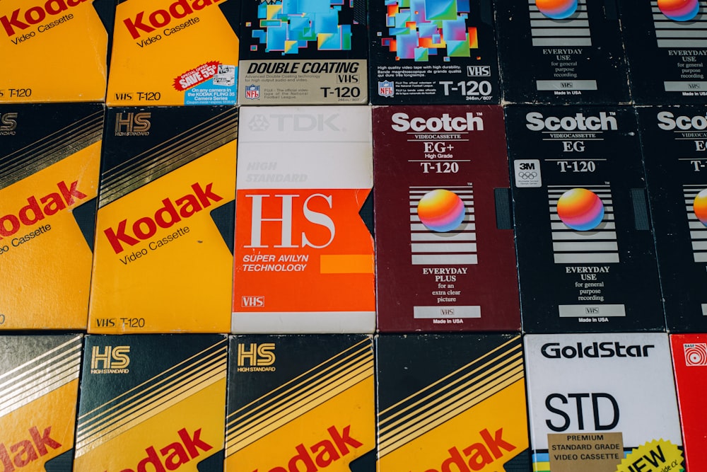 a pile of different colored and black and yellow business cards