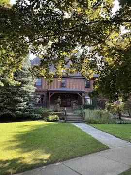A modern family home with a welcoming front porch and lush garden.