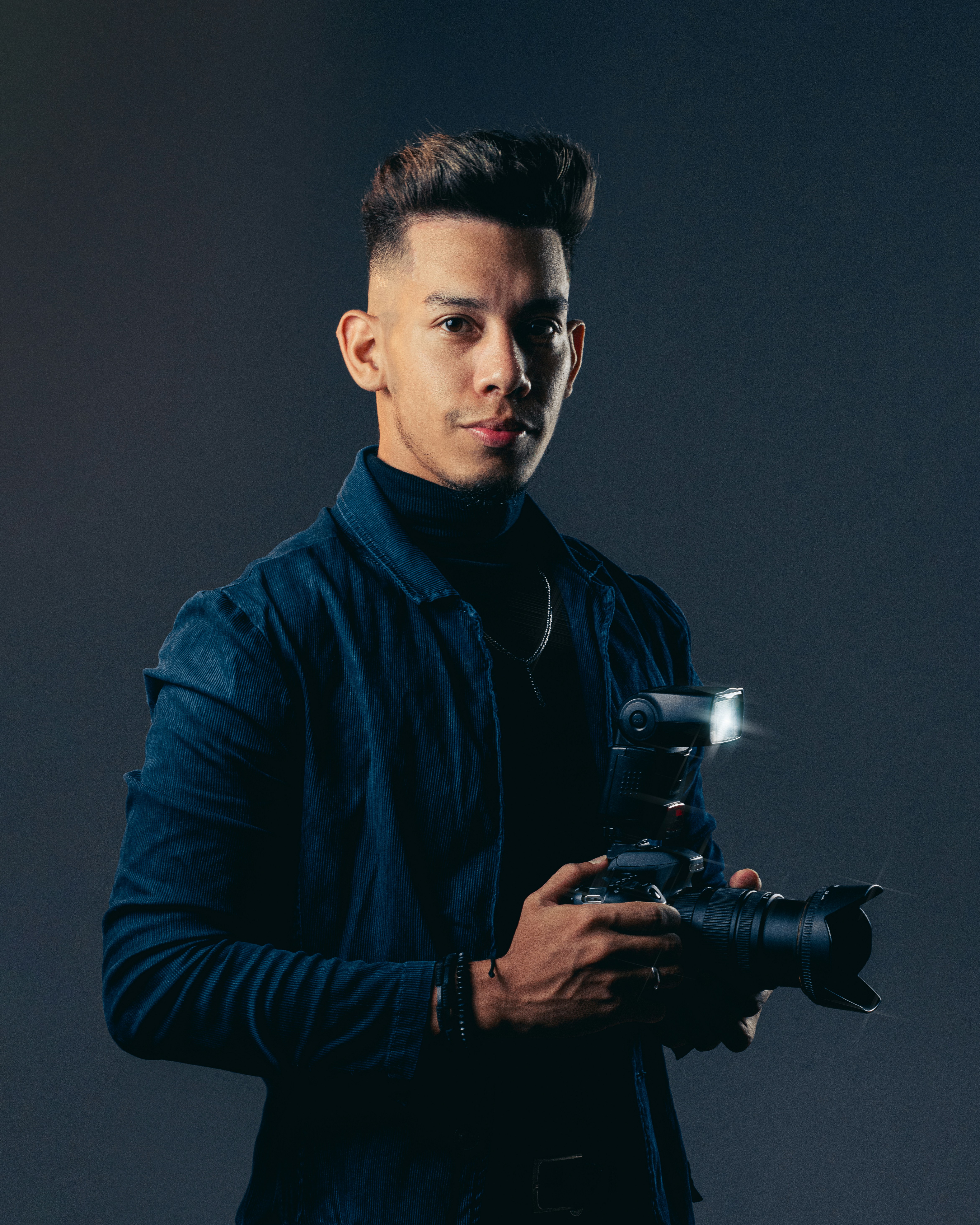 a man holding a camera in his hands