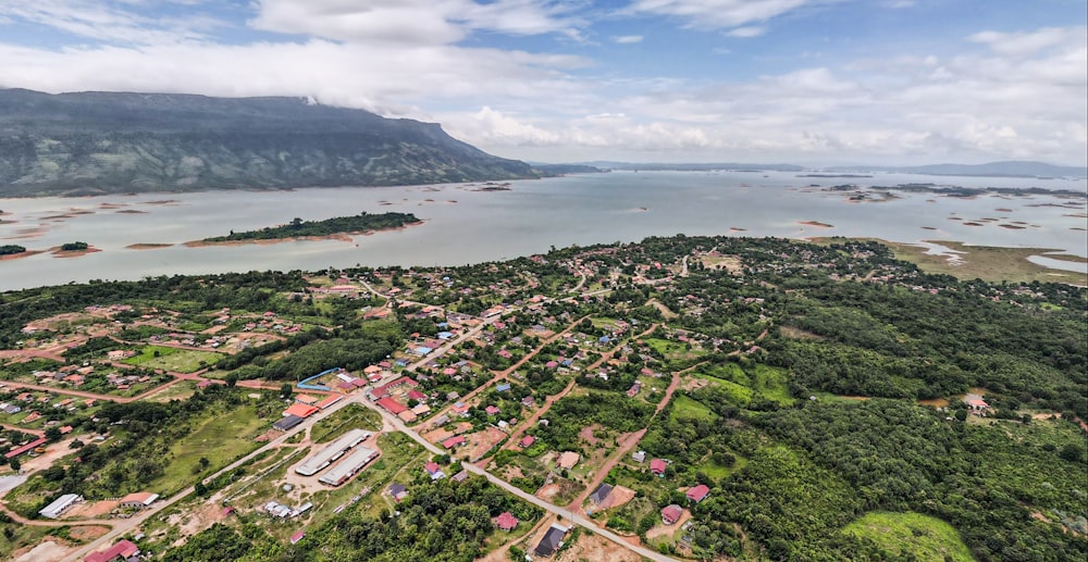 a bird's eye view of a small town near a body of water