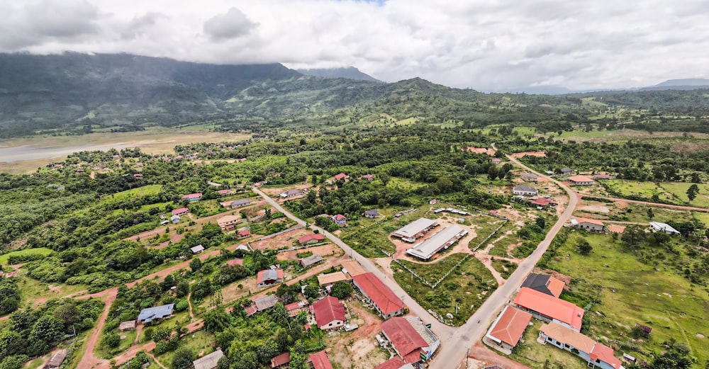 an aerial view of a small town surrounded by mountains