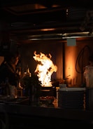 A warm kitchen scene with a food creator filming a batch cooking video.