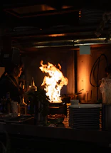 A cozy kitchen scene with a warm pan sizzling with fresh ingredients, inviting connection.