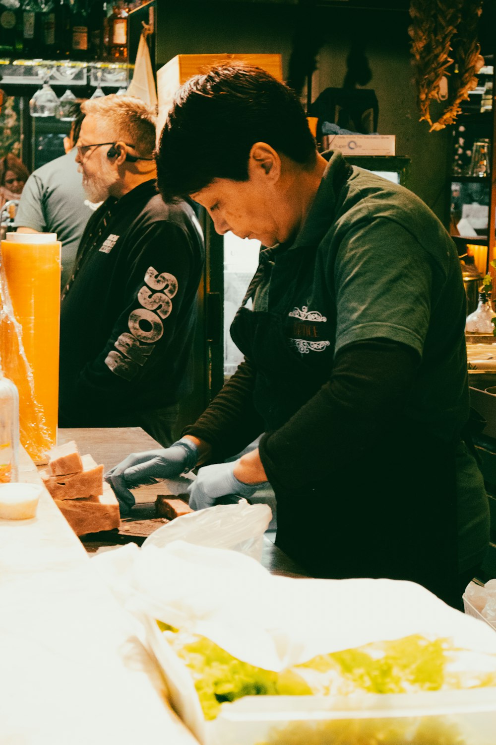 a man in a black shirt is making food