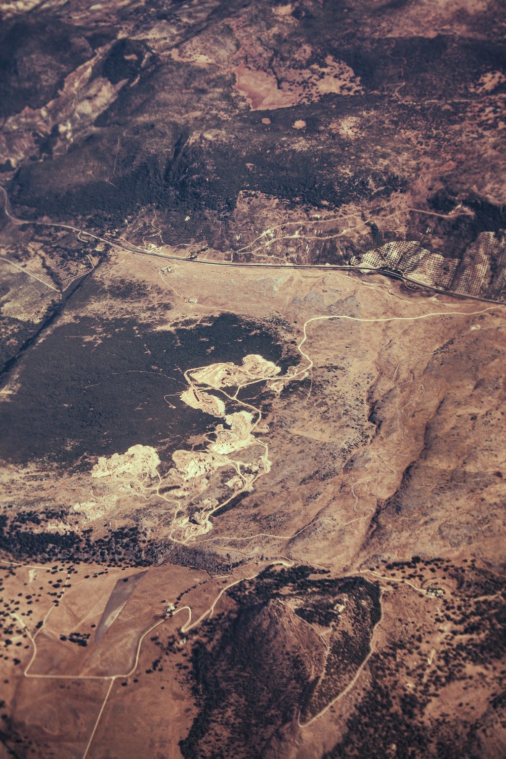 an aerial view of a mountain range with a river running through it