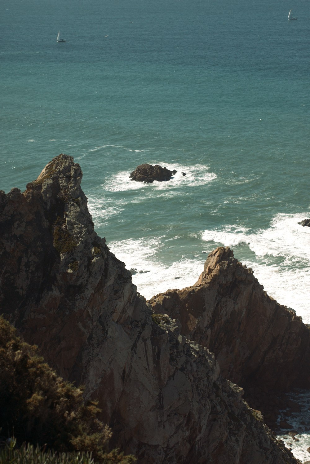 a view of the ocean from the top of a mountain