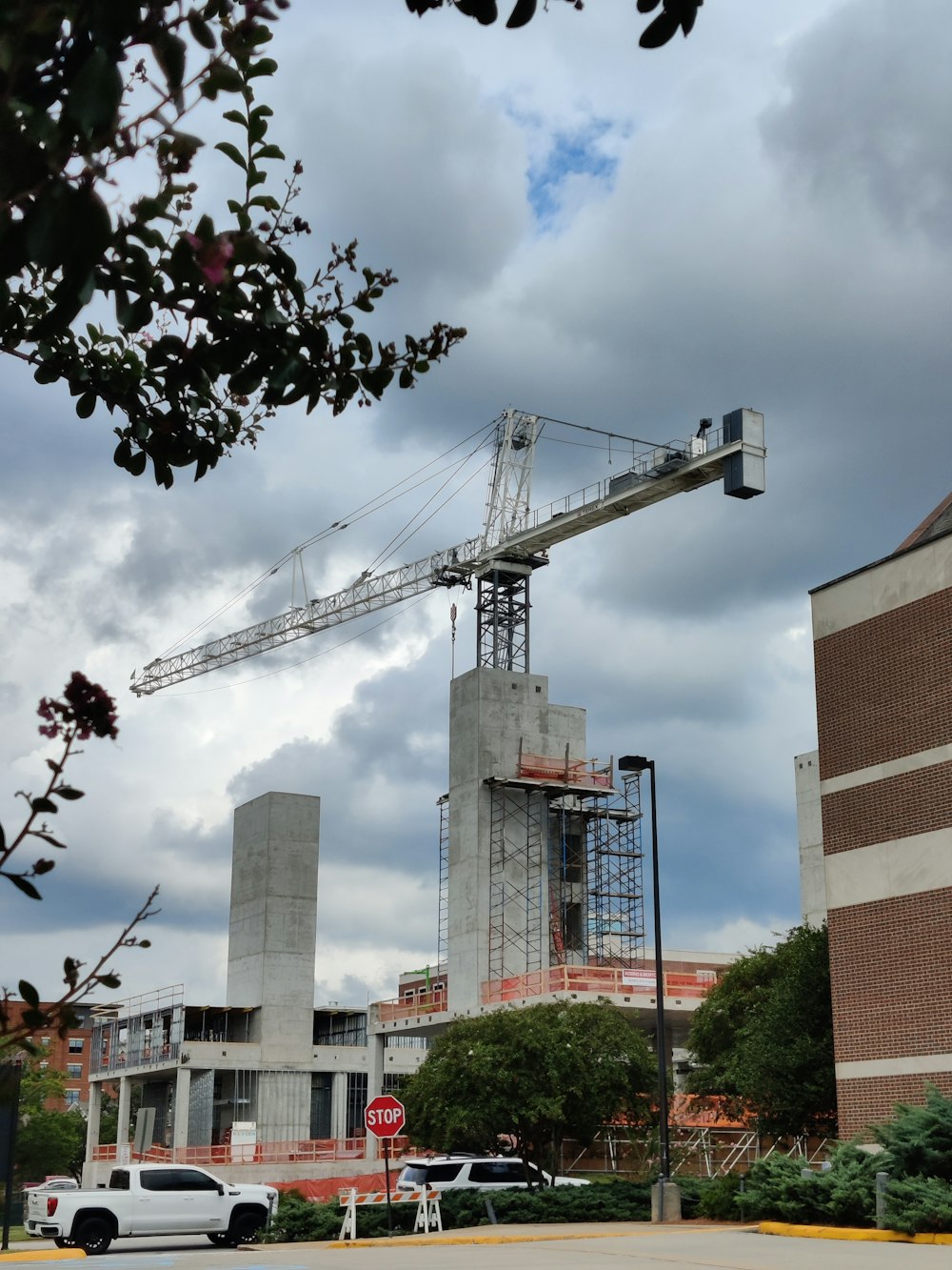a large crane sitting on top of a tall building