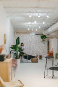 A professional consultant discussing plans with a client in a bright office.