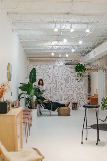 a woman sitting in a chair in a room