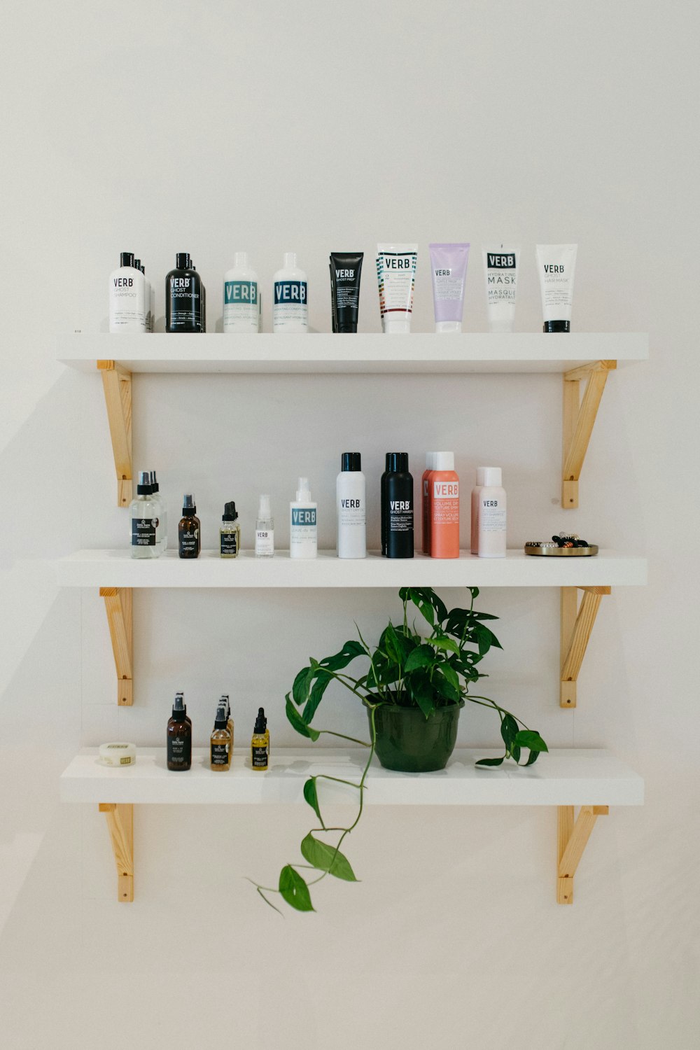 a shelf filled with lots of different types of hair products