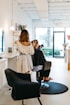 a woman getting her hair done in a salon