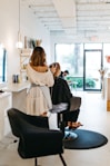 a woman getting her hair done in a salon