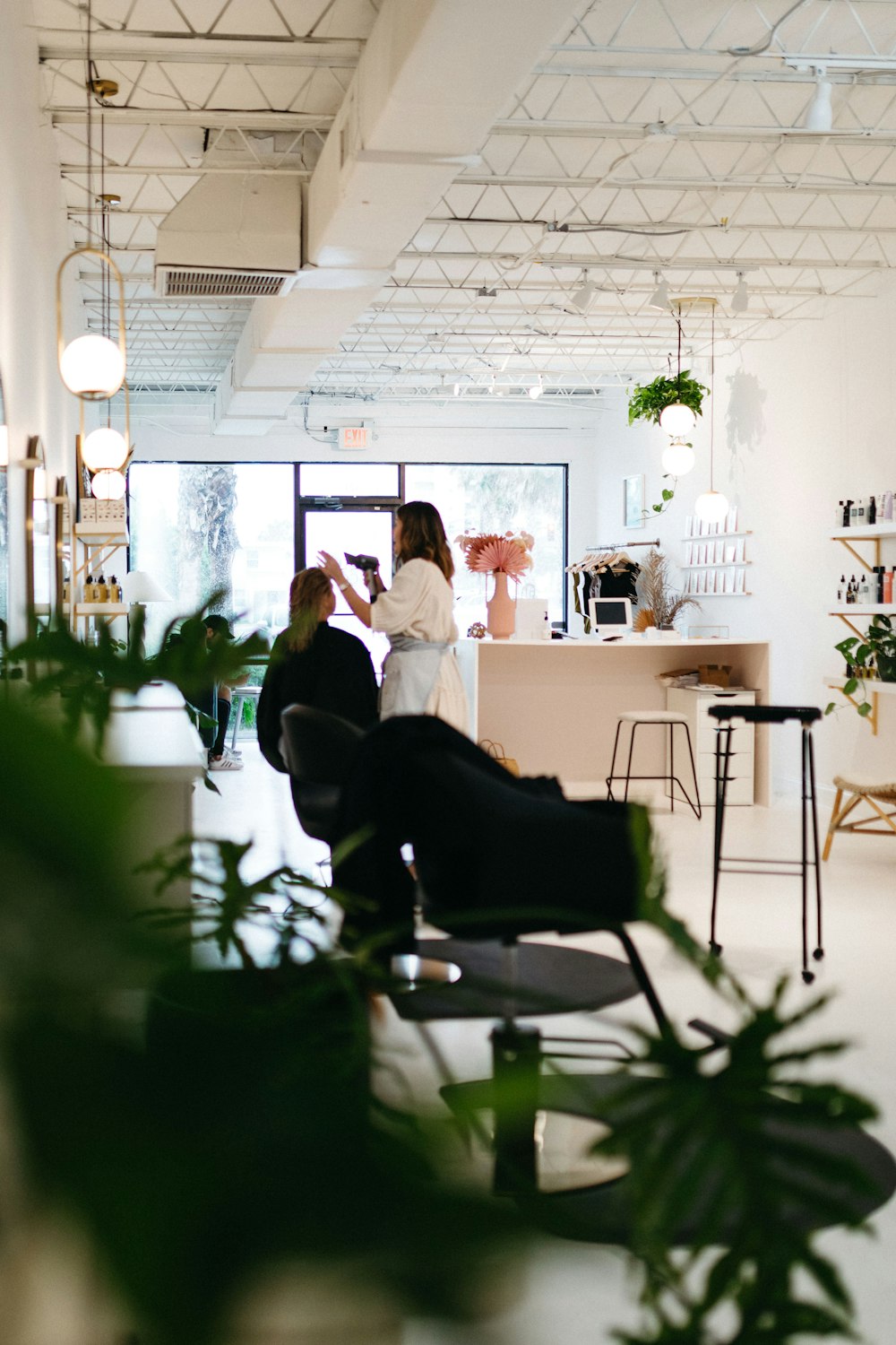 a couple of people sitting at a table in a room