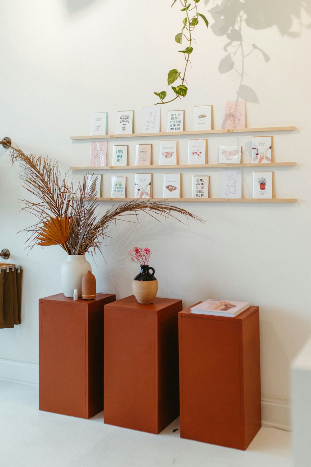 a couple of vases sitting on top of a wooden table