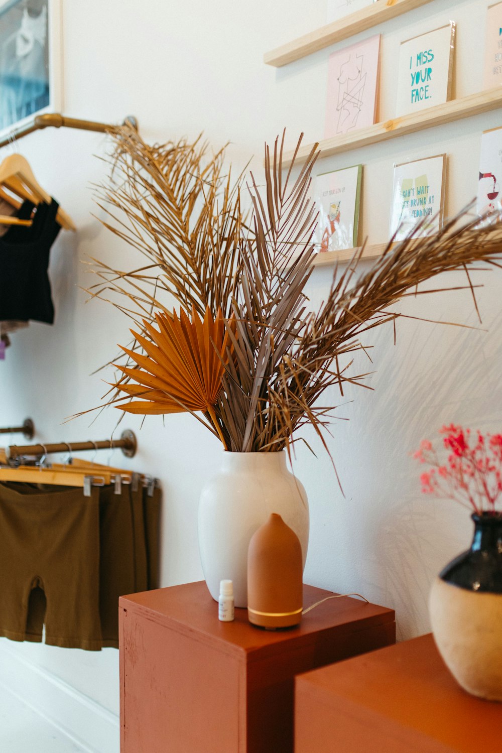 a vase with a plant in it sitting on a table