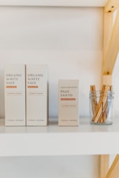 A display of Bach flower remedies arranged aesthetically on a wooden shelf.