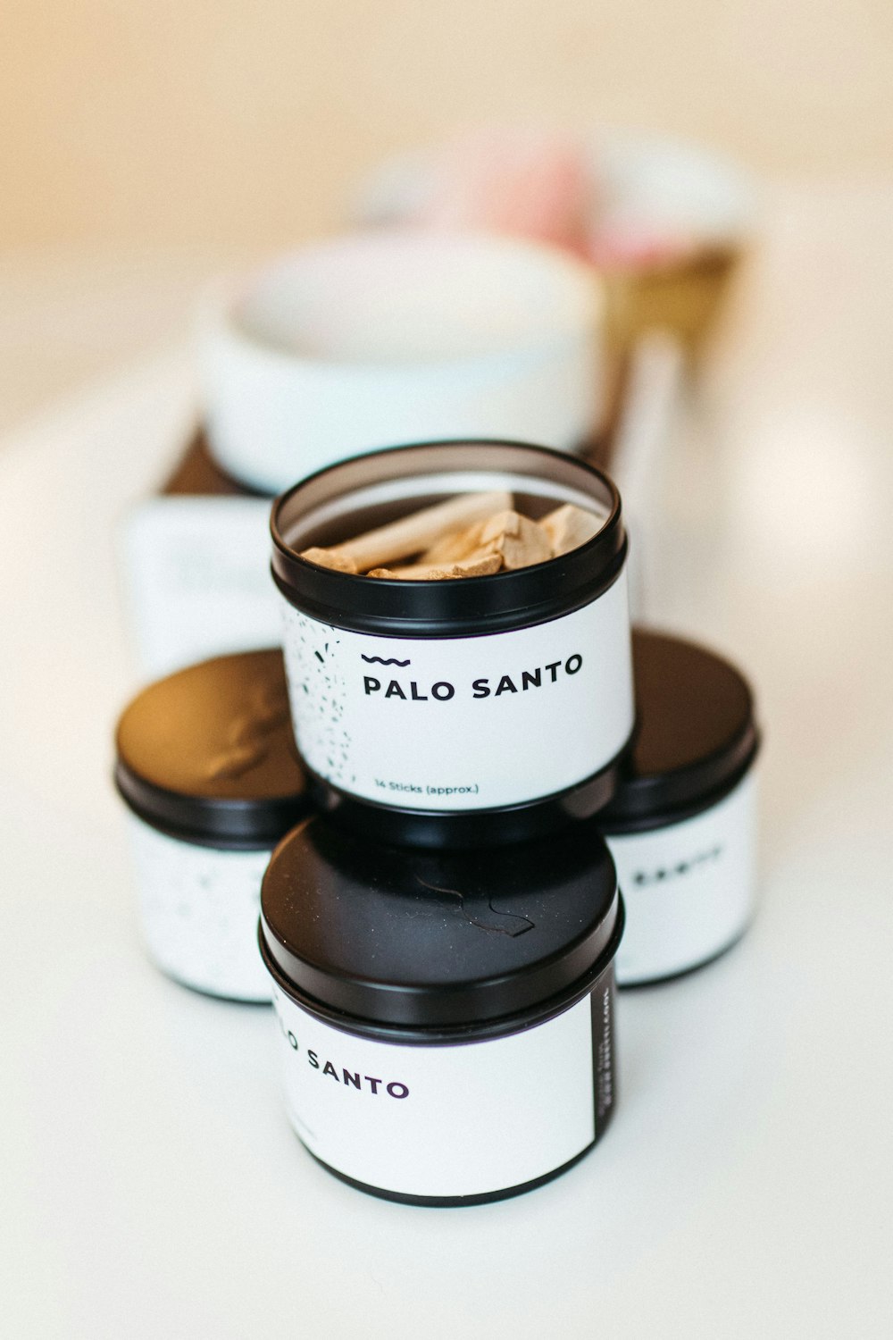 a close up of four containers of food on a table