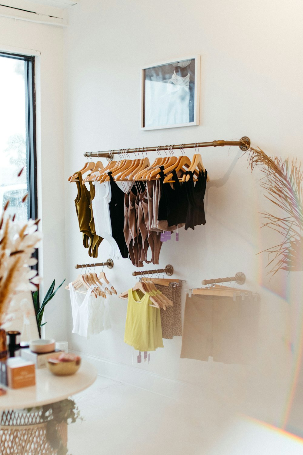 a room with clothes hanging on a rack