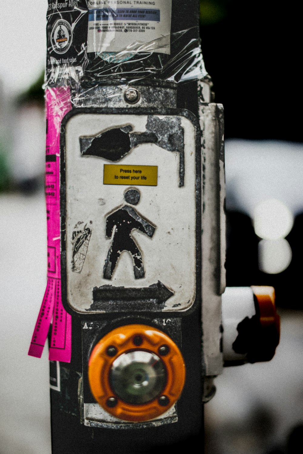 a close up of a parking meter with a sticker on it