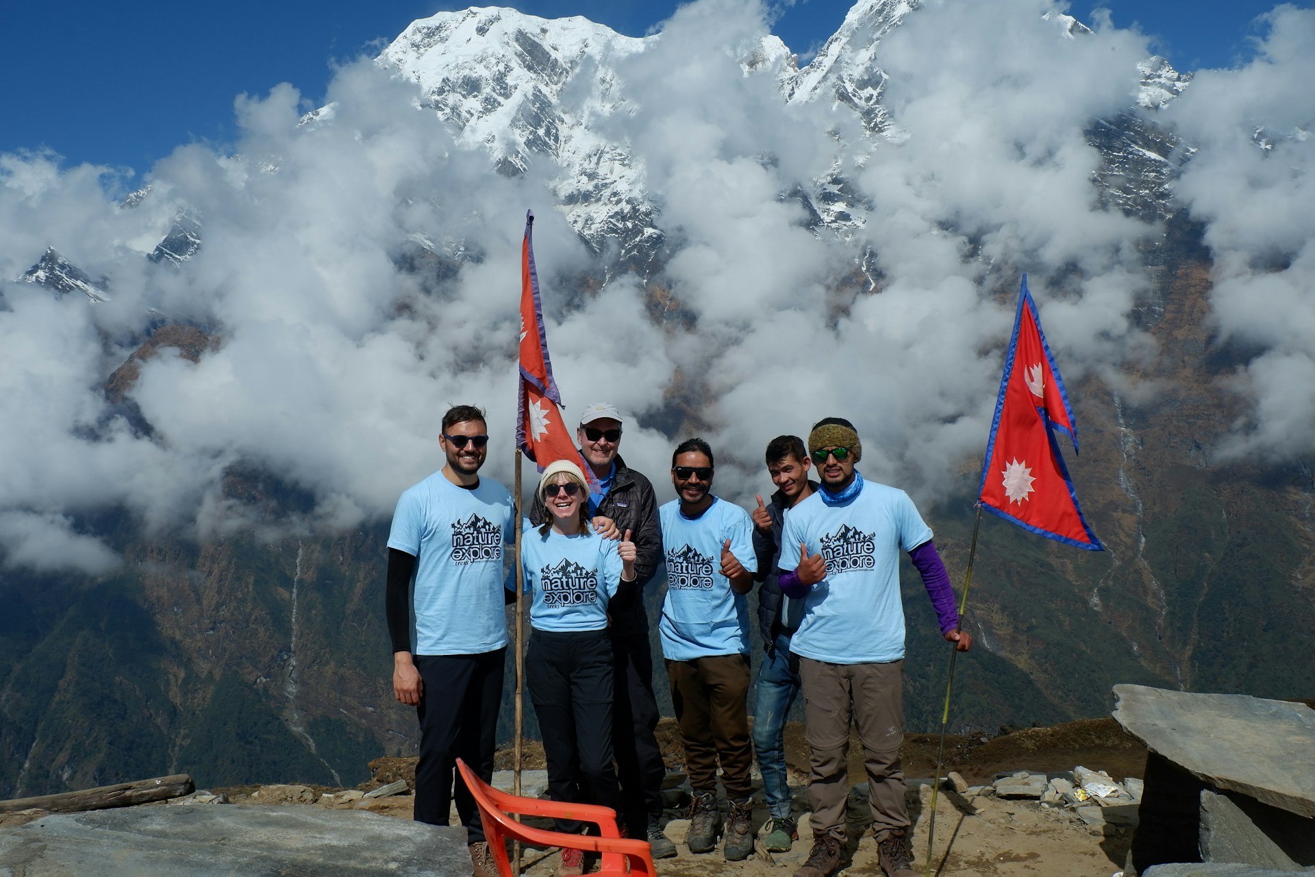 woman wearing yellow long-sleeved dress under white clouds and blue sky during daytime