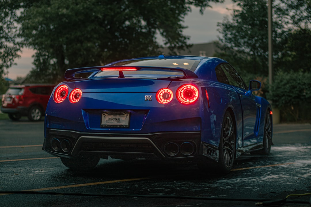 a blue sports car parked in a parking lot, GTR r35 after wash and detail