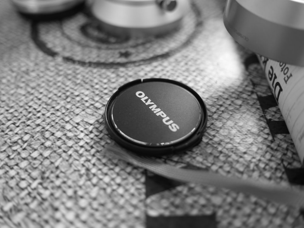 a black and white photo of a camera lens cap