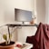A stylish workspace adorned with modern decor items and a cactus plant.