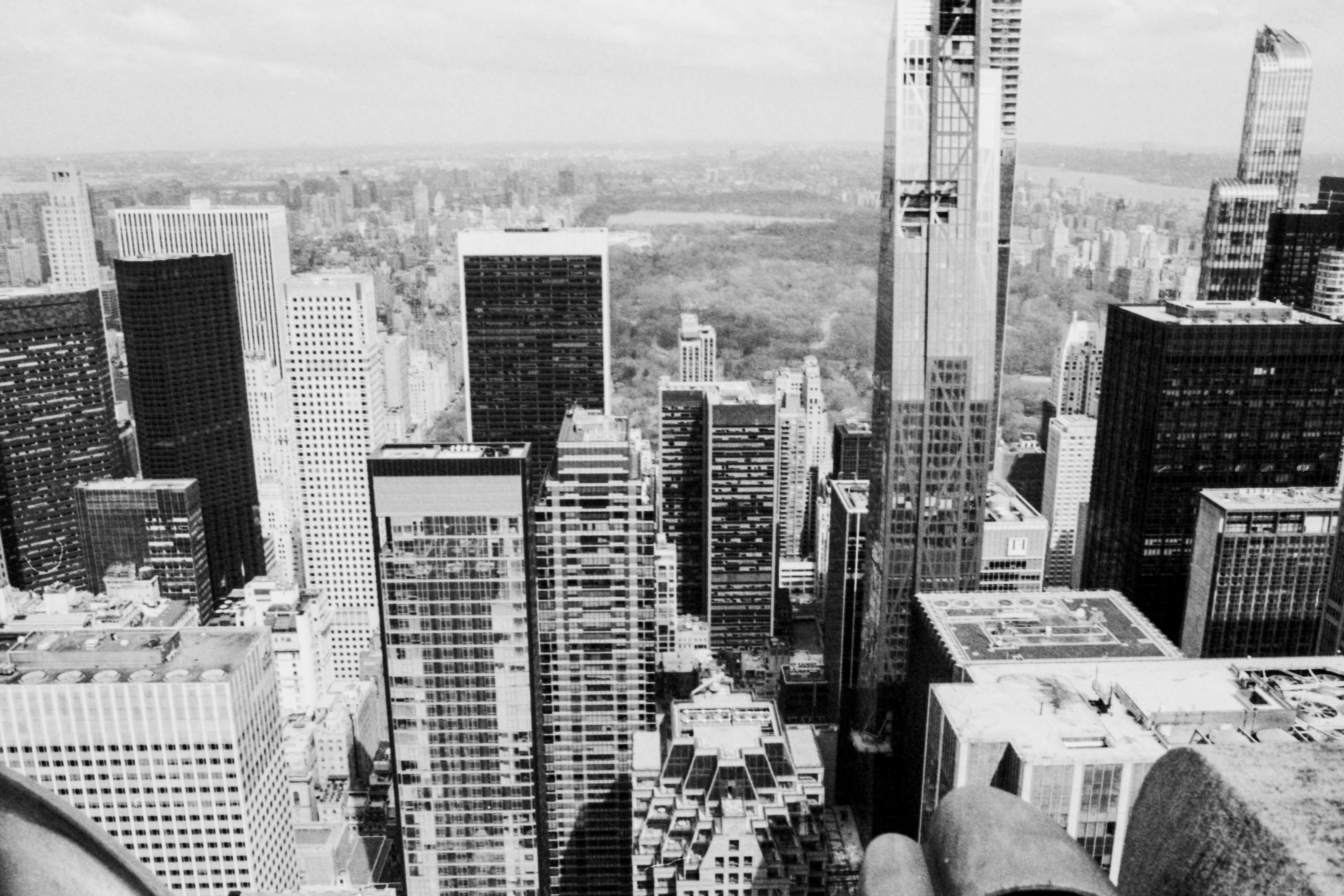 a person standing on top of a tall building